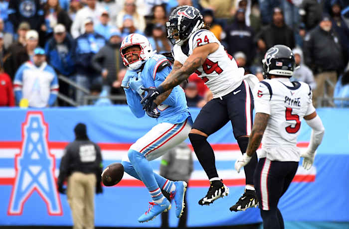 Titans' wide receiver DeAndre Hopkins has a pass broken up by Houston Texans cornerback Derek Stingley Jr. during the second half at Nissan Stadium.